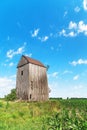 Old wooden windmill in cornfield Royalty Free Stock Photo