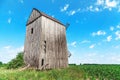 Old wooden windmill in cornfield Royalty Free Stock Photo