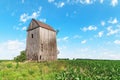 Old wooden windmill in cornfield Royalty Free Stock Photo