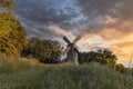 Old wooden windmill at dramatic sunset, historic outdoor background Royalty Free Stock Photo
