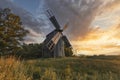 Old wooden windmill at dramatic sunset, historic outdoor background Royalty Free Stock Photo