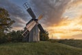 Old wooden windmill at dramatic sunset, historic outdoor background Royalty Free Stock Photo