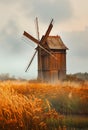 Old wooden windmill in the field Royalty Free Stock Photo