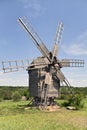 Old wooden windmill on the grassland Royalty Free Stock Photo