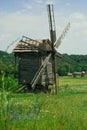 Old wooden windmill in a meadow Royalty Free Stock Photo