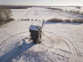 Old wooden windmills aerial top view in the snow winter