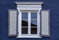 Old wooden window with blinds.Front view. Old fashioned style