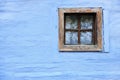 Old wooden window on blue wall Royalty Free Stock Photo