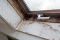 Old wooden window frame with dirty mold and broken inside a old house, needs renovation Royalty Free Stock Photo