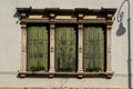 Old wooden window with italian style shutters Royalty Free Stock Photo