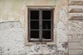 Old wooden window, no glass, just frame on an old abandoned building Royalty Free Stock Photo