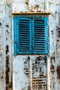 Old wooden window painted blue with rusty lock. Texture, wall of an old wooden house with shuttered windows, painted blue. Royalty Free Stock Photo