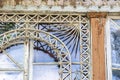 Old wooden window. Peeling paint and wooden details Royalty Free Stock Photo