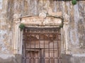 Old wooden window with the  rusty metal fence and peeled wall Royalty Free Stock Photo