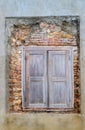 Old wooden window shutters and exposed brick wall revival process, beautiful backdrop for a model shoot Royalty Free Stock Photo