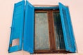 Old wooden window shutters with floral ornaments on glass