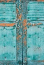 Old wooden window shutters in turquoise color.cracked peeling paint. grunge background. Royalty Free Stock Photo