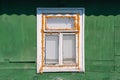 Old wooden window on the wall of a house in the countryside Royalty Free Stock Photo