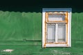 Old wooden window on the wall of a house in the countryside Royalty Free Stock Photo