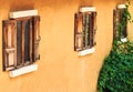 Old Wooden Window on Yellow Wall Royalty Free Stock Photo