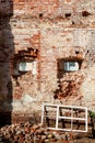 Old wooden windows on the background of an old brick wall Royalty Free Stock Photo