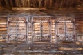 Old wooden windows with closed shutters Royalty Free Stock Photo