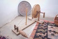 The old wooden wool winding machine with materials .Old fashioned wooden distaff, spindle, spinning wheel . wool thread in the