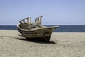 old wooden worn fishing boats abandoned on the beach of Cabo de Gata, Almeria, Spain.