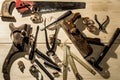 old woodworks tools: wooden planer, hammer, chisel in a carpentry workshop on wood background Royalty Free Stock Photo