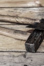 Old work tool builder closeup hammer black ax shabby wooden background