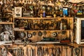 Old working tool on the background of wooden panels, the tools of the artisan hang on nails