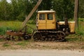 Old working tractor stands on a field in Ukraine to dig up land Royalty Free Stock Photo