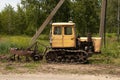 Old working tractor stands on a field in Ukraine to dig up land Royalty Free Stock Photo