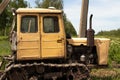 Old working tractor stands on a field in Ukraine to dig up land Royalty Free Stock Photo