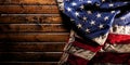 Worn American flag on dark wooden background Royalty Free Stock Photo