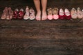 Old worn baby (child, kid) shoes on the floor. sandals, boots, s Royalty Free Stock Photo