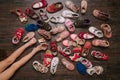 Old worn baby (child, kid) shoes on the floor. sandals, boots, s Royalty Free Stock Photo