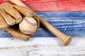 Old worn baseball equipment on faded boards painted in American