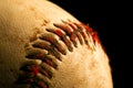 Old worn baseball showing dirty red stitches Royalty Free Stock Photo