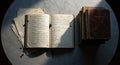 An old worn book lies open on a white marble table surrounded by handwritten notes and scattered papers with a stack of vintage Royalty Free Stock Photo