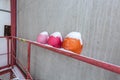 Old, worn, colorful and safety helmets of engineering construction workers with snow are on the hand railings of Royalty Free Stock Photo