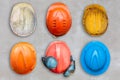 Old and worn construction helmets Royalty Free Stock Photo