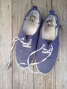 Old worn out and dirty blue sneakers Royalty Free Stock Photo