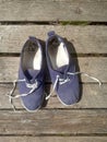 Old worn out and dirty blue sneakers Royalty Free Stock Photo