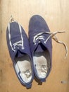 Old worn out and dirty blue sneakers Royalty Free Stock Photo