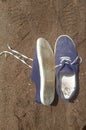 Old worn out and dirty blue sneakers Royalty Free Stock Photo