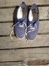 Old worn out and dirty blue sneakers Royalty Free Stock Photo