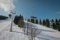 Old and worn gondola or ski lift on Soriska planina in slovenia on a sunny winter day