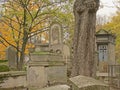Old worn stone grave monuments in Mont martre cemetery, Paris, France, Royalty Free Stock Photo