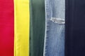 Old worn jeans 5 different colors, jeans background, the background of clothing, torn jeans Royalty Free Stock Photo